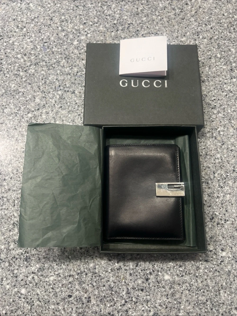 Gucci Black Leather Bifold Card Holder with Silver G-Clip Accent